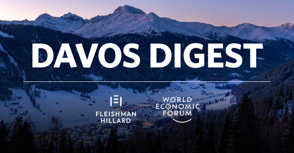 Mountain range at dusk with the logos for FleishmanHillard and the World Economic Forum